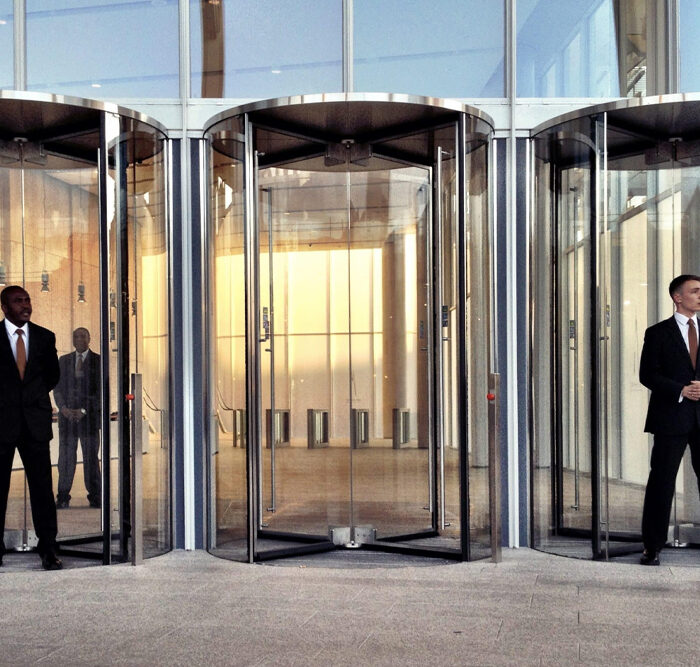 Security guard standing outside hotel